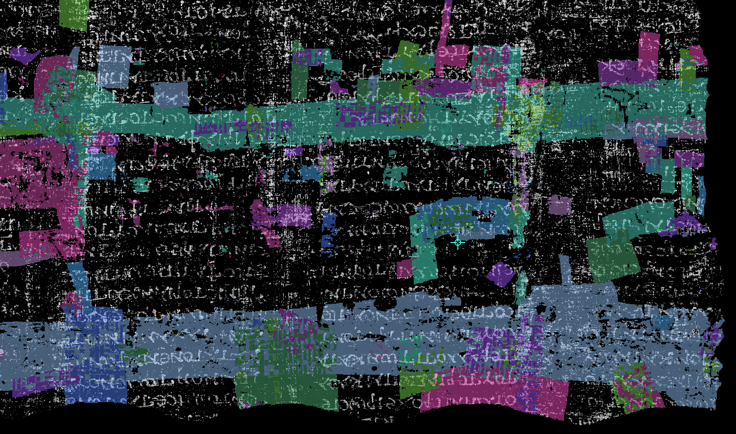 Many small, colored surface-patch annotations distributed across a scroll-volume slice